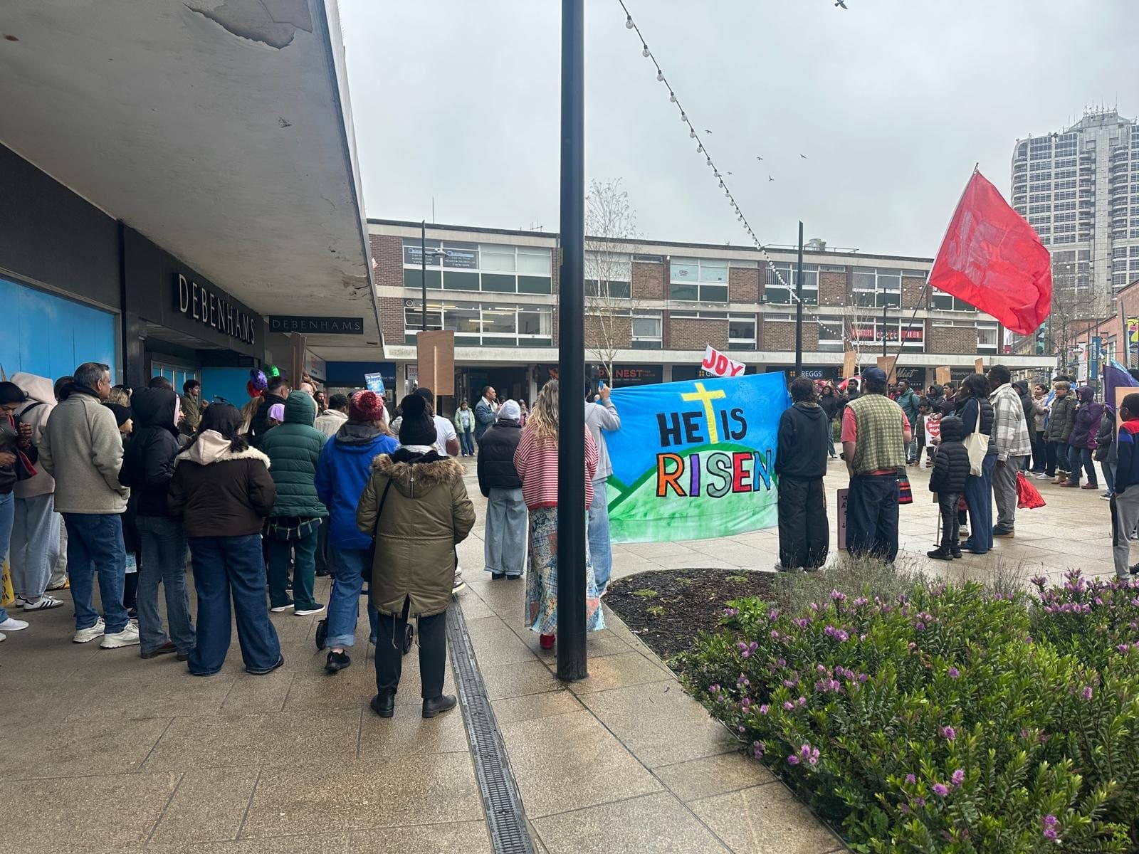 Christians gathered in Swindon town centre at Easter with a banner reading 'He is risen'